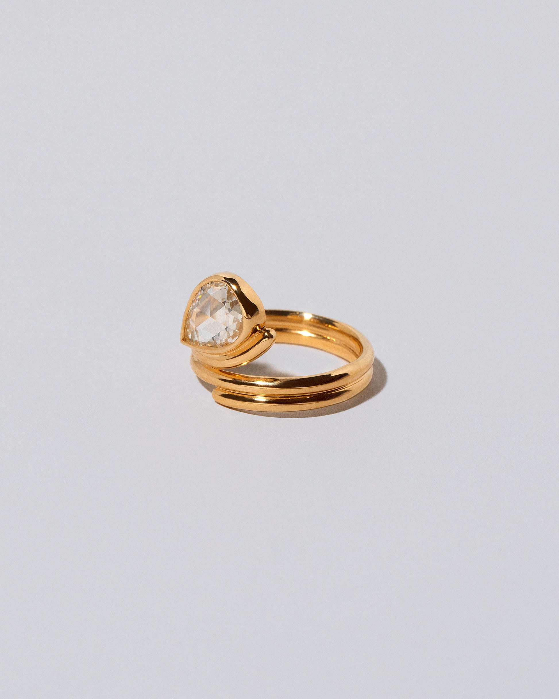 View from the side of the Diamond Light Cutter Ring on light color background.