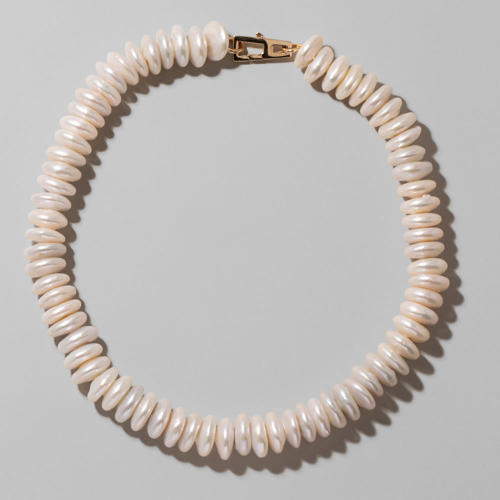product_details::Button Pearl Choker Necklace on light color background.