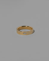 Gold Diamond East West 5mm Baguette-Set Piet Band on light color background.