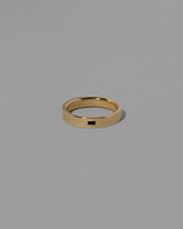 Gold Black Spinel East West 4mm Baguette-Set Piet Band on light color background.