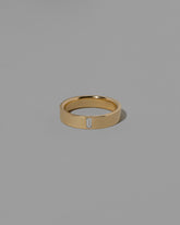 Gold Diamond North South 5mm Baguette-Set Piet Band on light color background.
