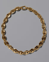 CRZM Gold Bedrock Bracelet on light color background.