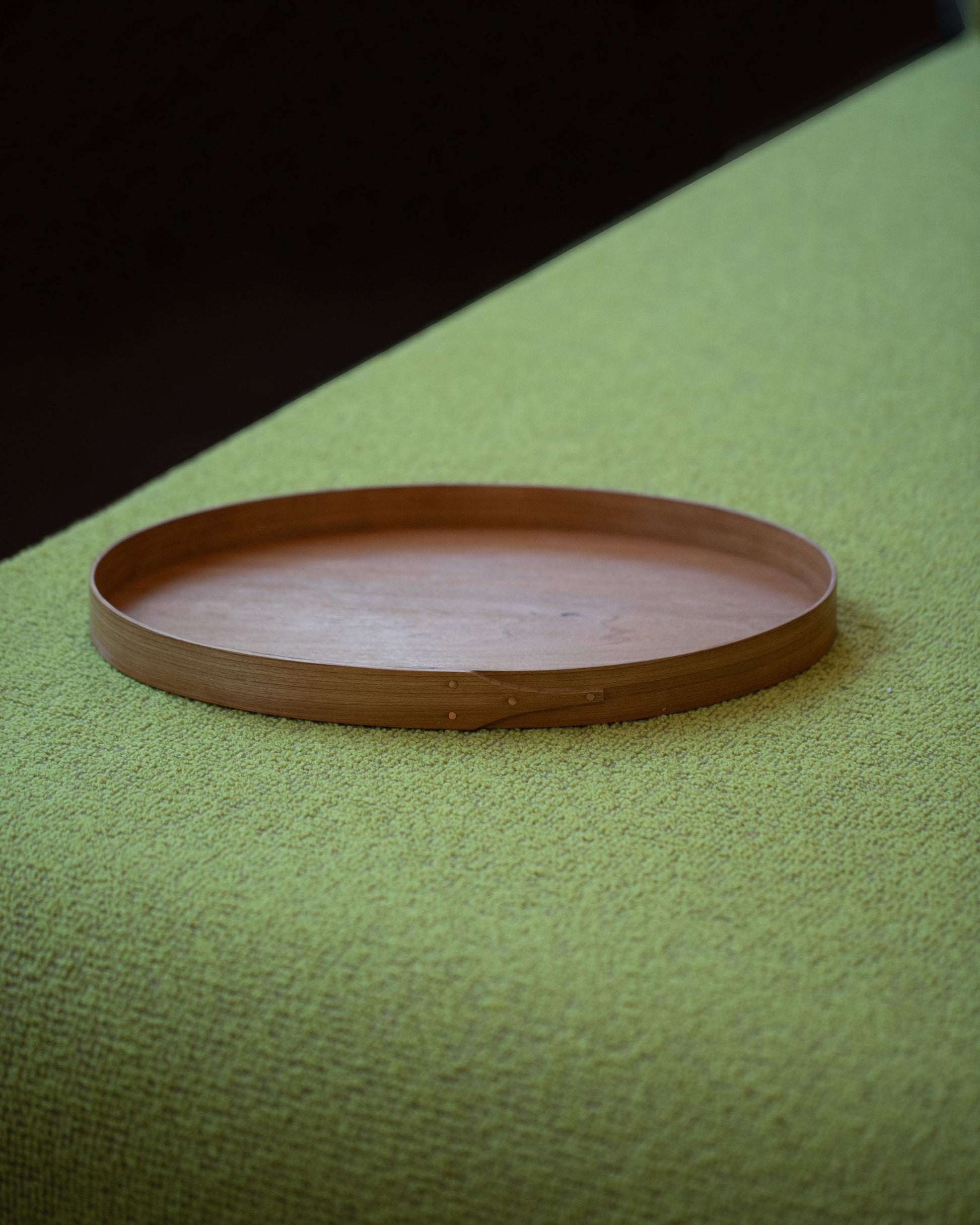 Rikke Falkow Small Cherry Wood Serving Tray on light color background.