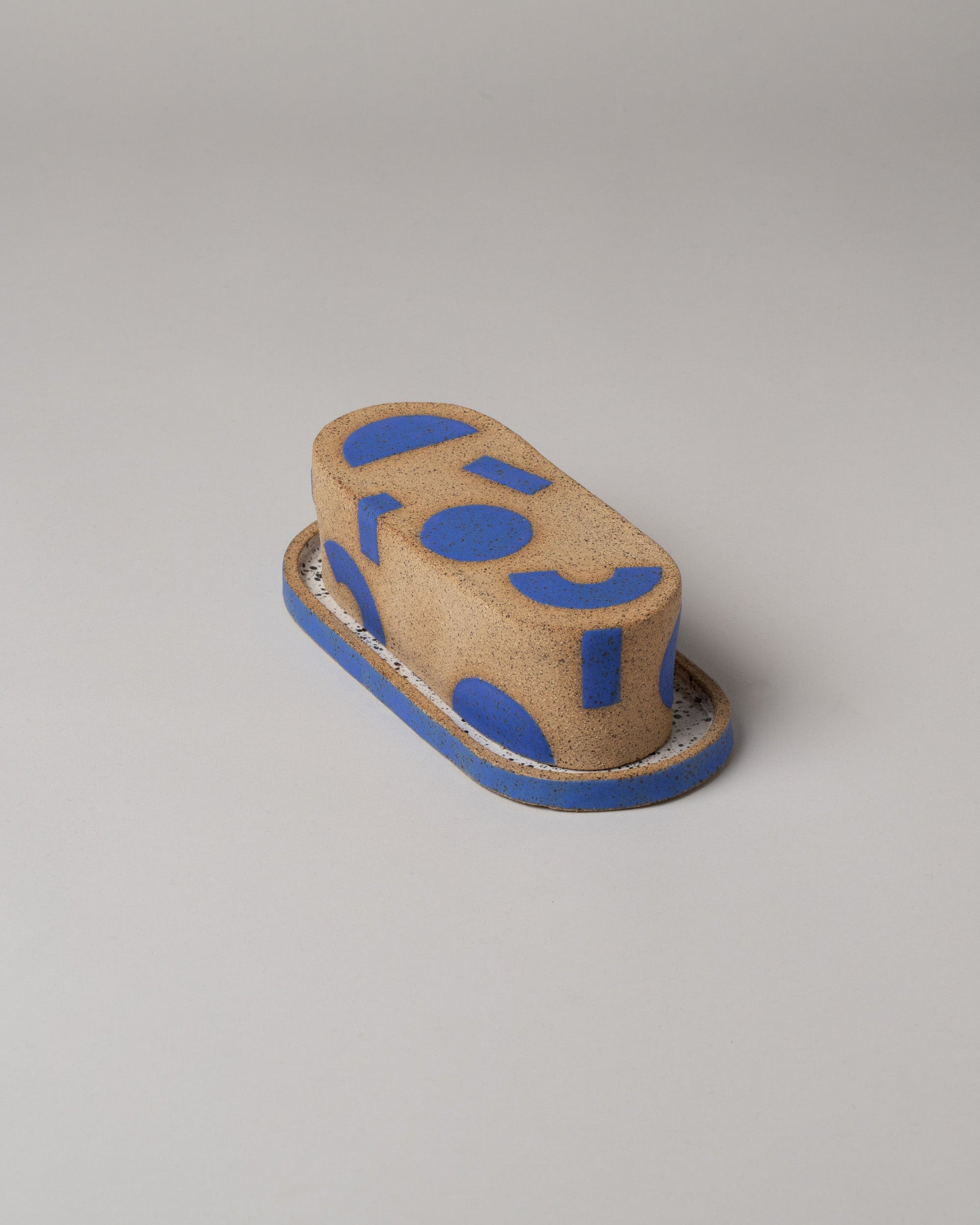 Recreation Center Blue Shapes Butter Dish on light color background.