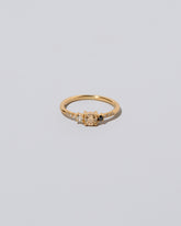 Champagne & Black Diamond Patira Ring on light color background.