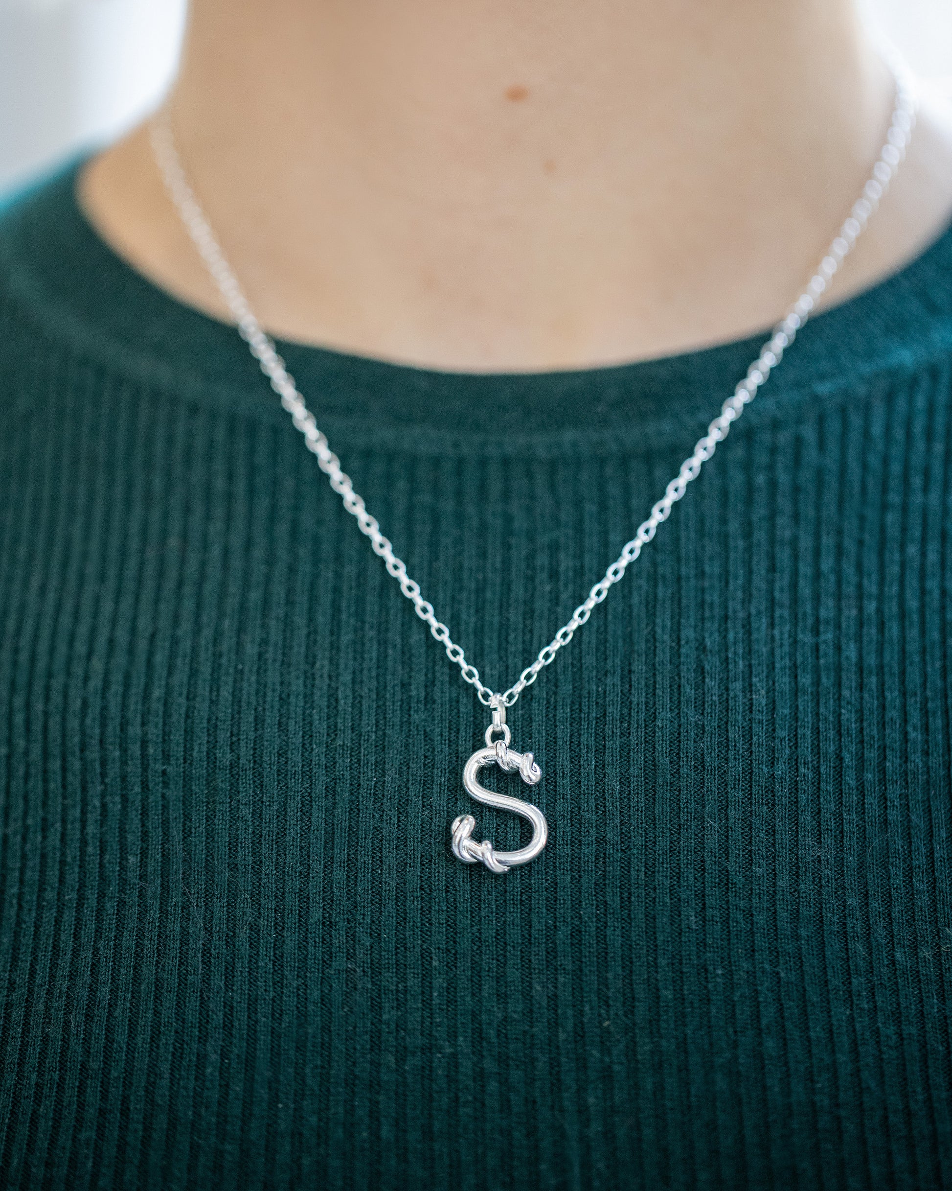 CRZM 2mm Sterling Silver Short Loop Chain Necklace and CRZM Letter S Medium Sterling Silver Letter Charms on model.