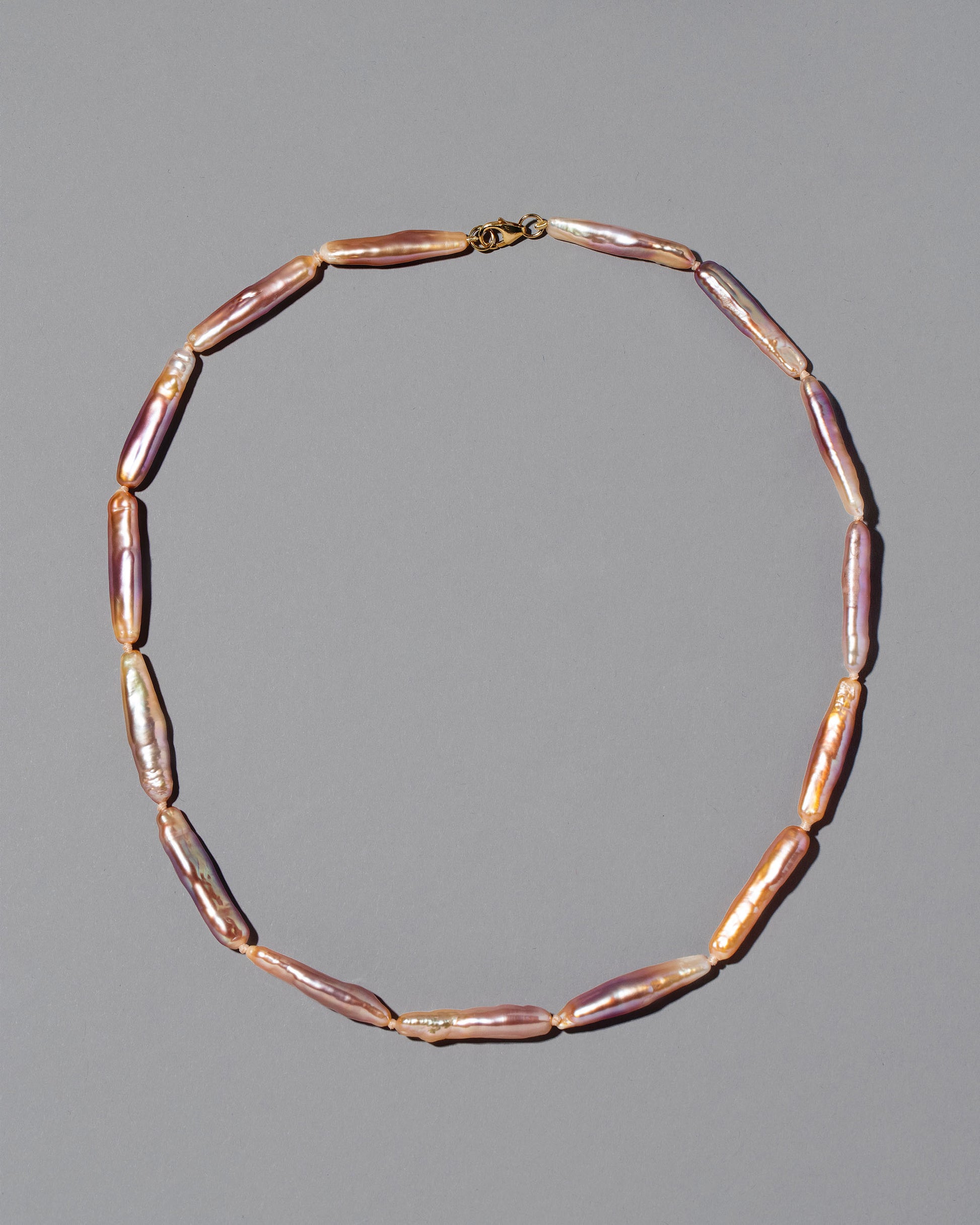 Blush Stick Pearl Strand Necklace on grey color background.