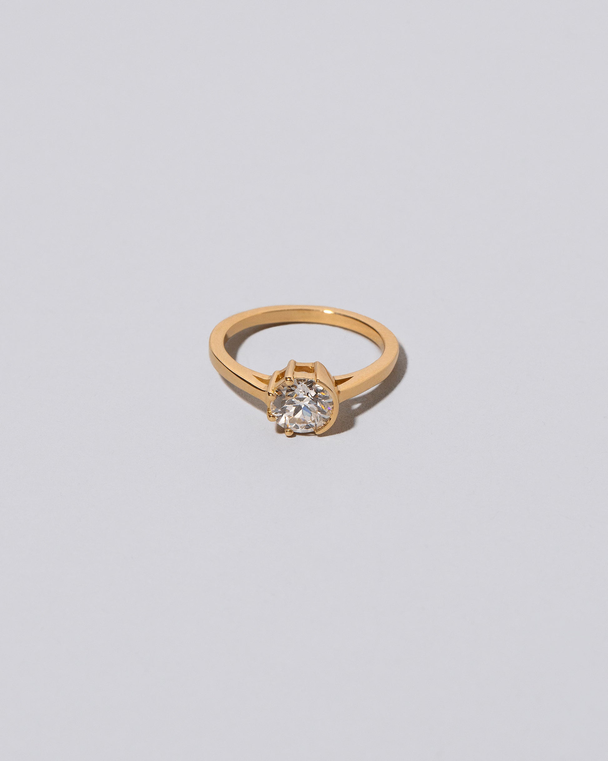 White Diamond Sun & Moon Ring on light color background.