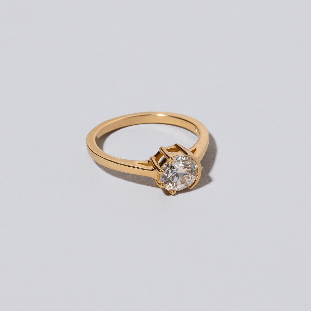product_details::Closeup details of the White Diamond Sun & Moon Ring on light color background.