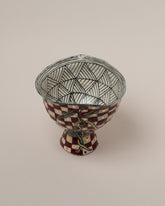 Closeup details of the Suzanne Sullivan A Few Propositions Footed Bowl on light color background.