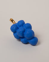 Closeup details of the Suzanne Sullivan Blue Grapes on light color background.