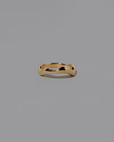 Gold Wide Fluctuating Band on light color background.