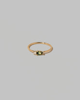 Bicolor Sapphire Teardrops Ring on light color background.