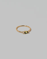 View from the side of the Bicolor Sapphire Teardrops Ring on light color background.