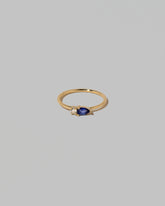 Blue Sapphire Teardrops Ring on light color background.