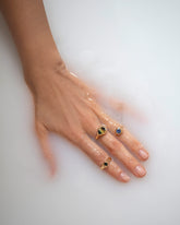 Bicolor Sapphire Grand Align Ring, Blue Sapphire Level Ring, and Green Sapphire Level Ring on model.