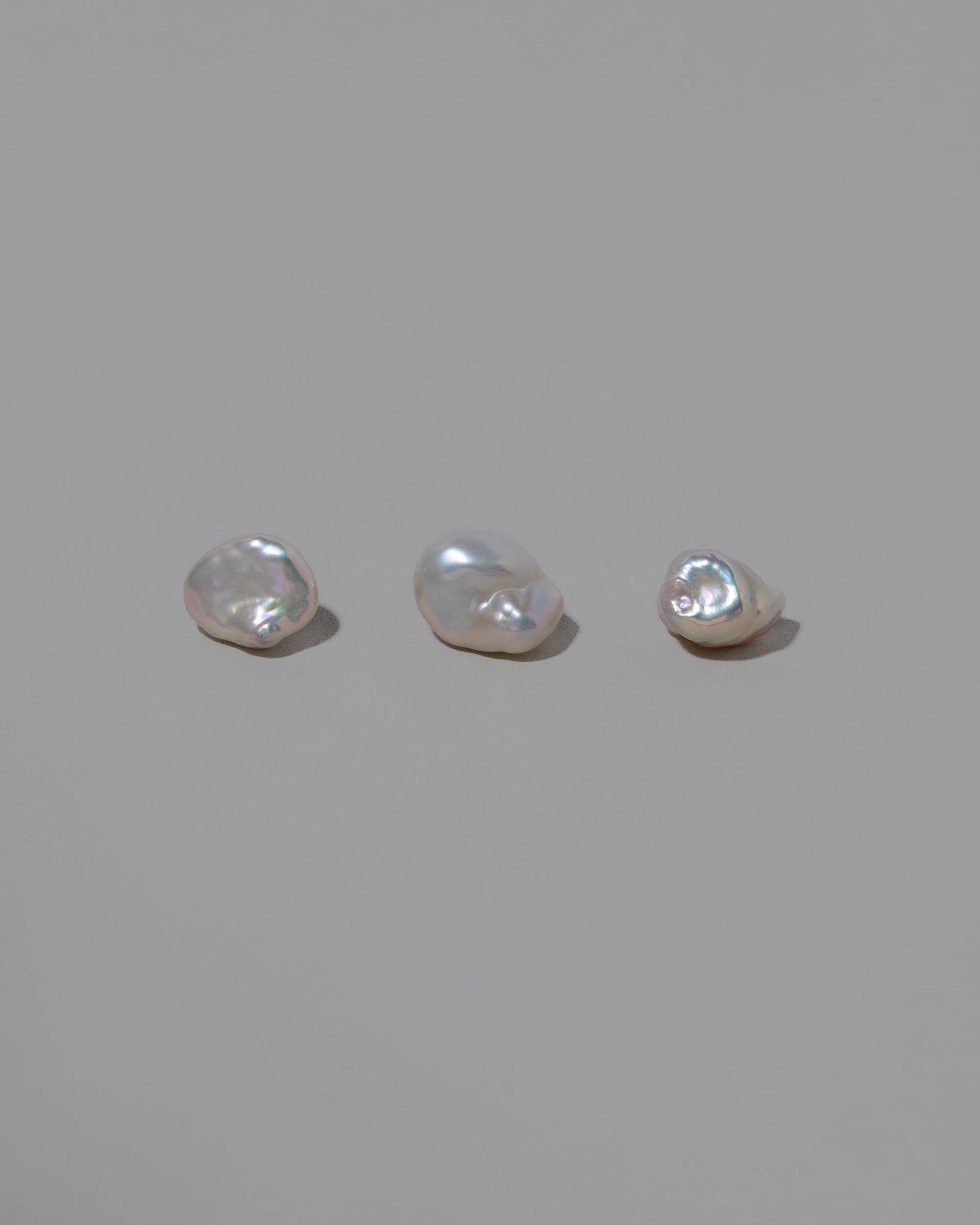 Natural Lagniappe Pearl Stud Earring Single on light color background.