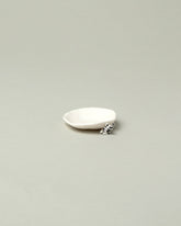 Eleonor Boström Black Spots Mini Cat Dish on light color background.