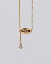 Closeup detail of the Diamond State Shifter Necklace on light color background.