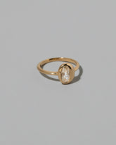 View from the side of the Moval Diamond Precise Ring on light color background.