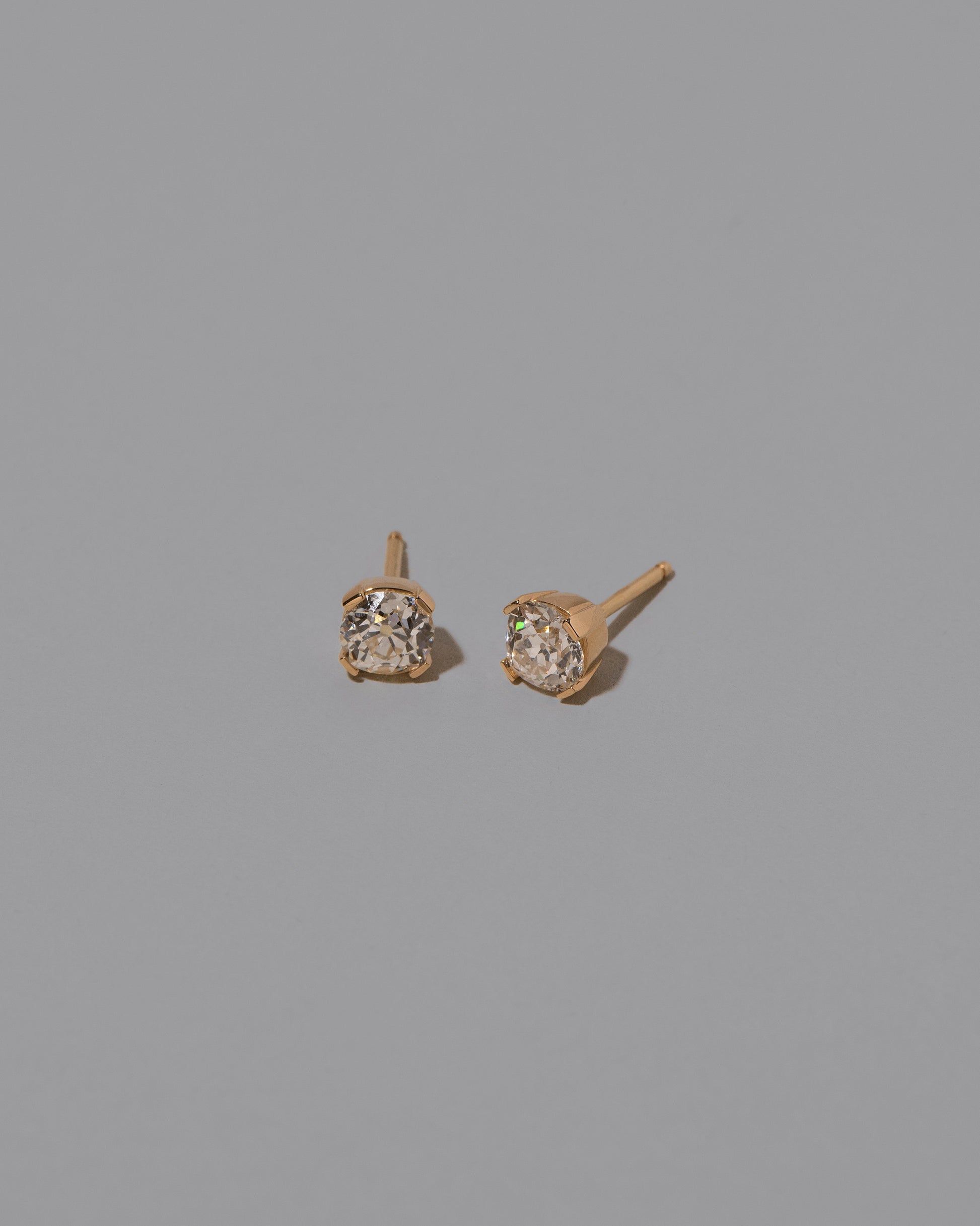 Inner Peace Earrings on light color background.