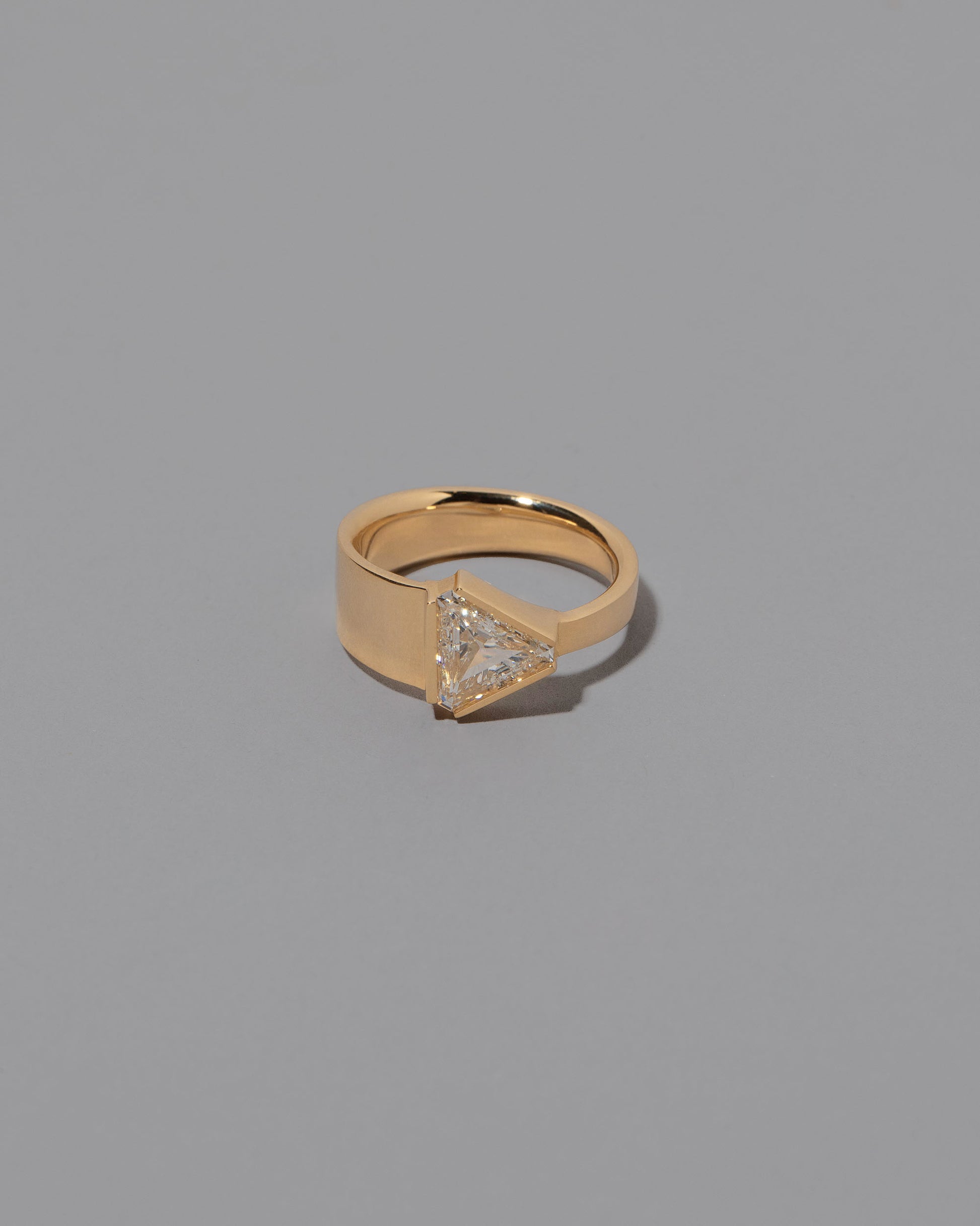 Tuck Ring on grey color background.