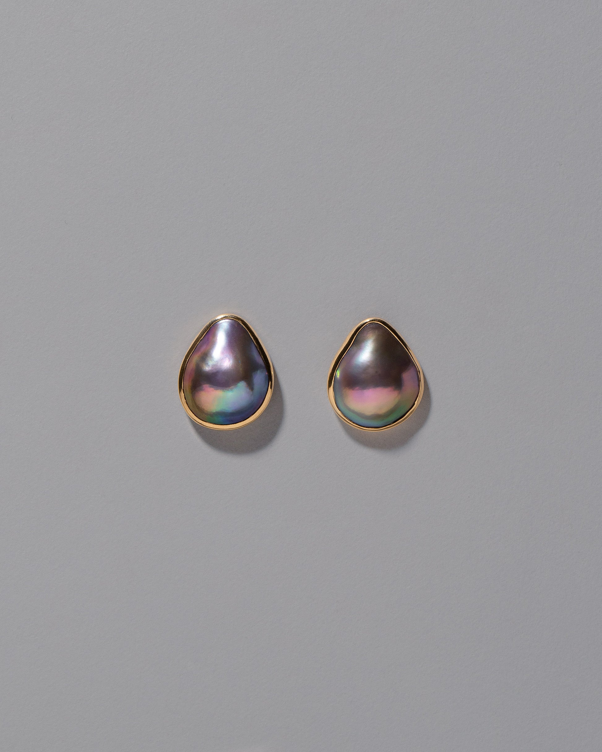 Black Moon Earrings on light color background.