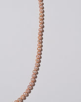 Freshwater Pearl Necklace on light color background.