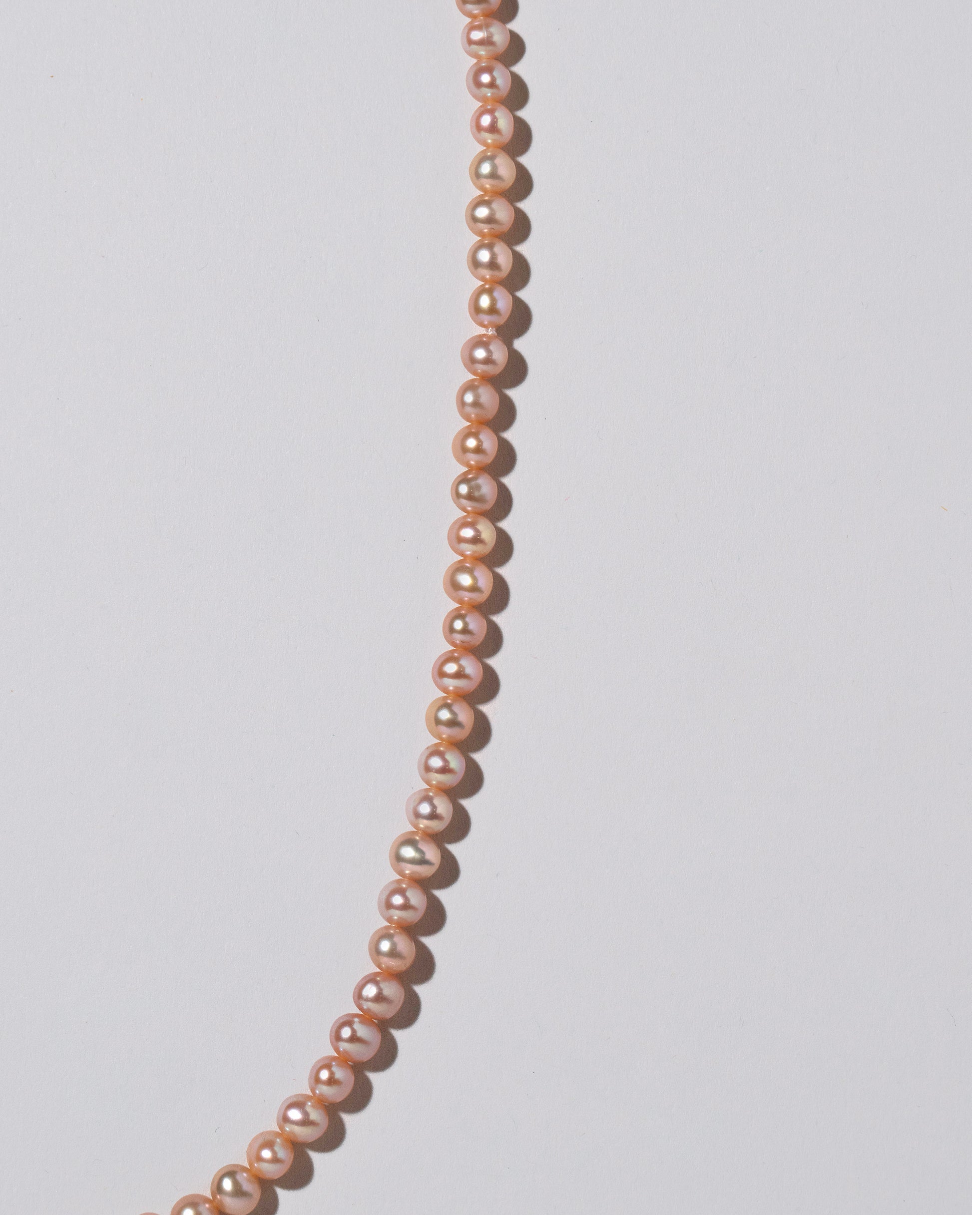 Freshwater Pearl Necklace on light color background.