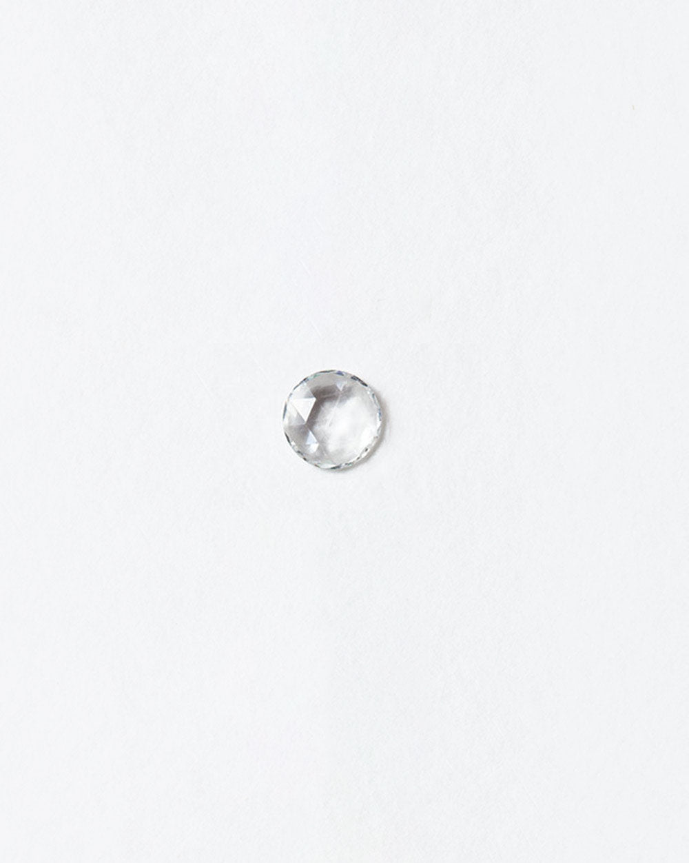 Rose cut Diamond cabochon on light color background.