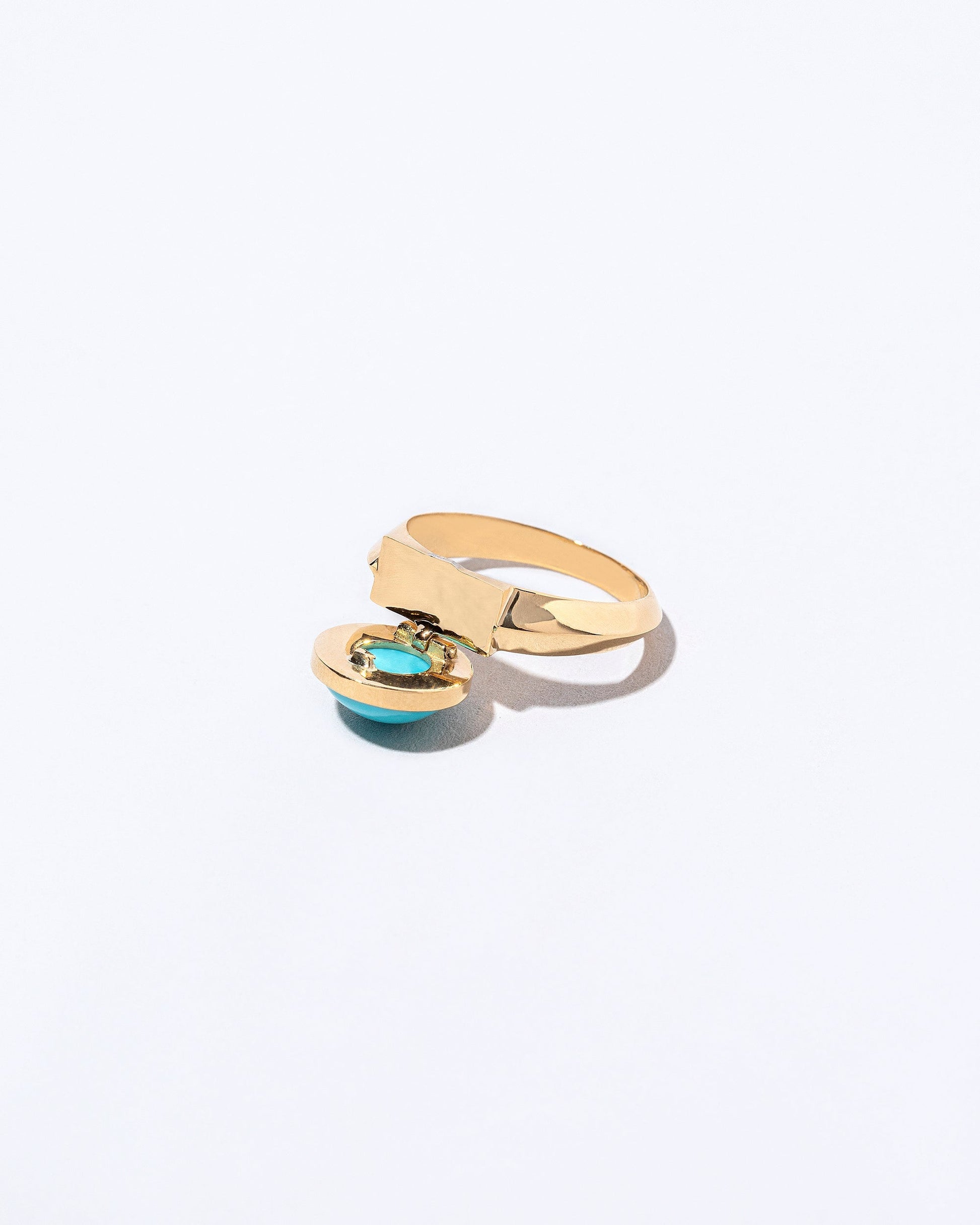 Secret Ring set turquoise showing engraving on light color background.