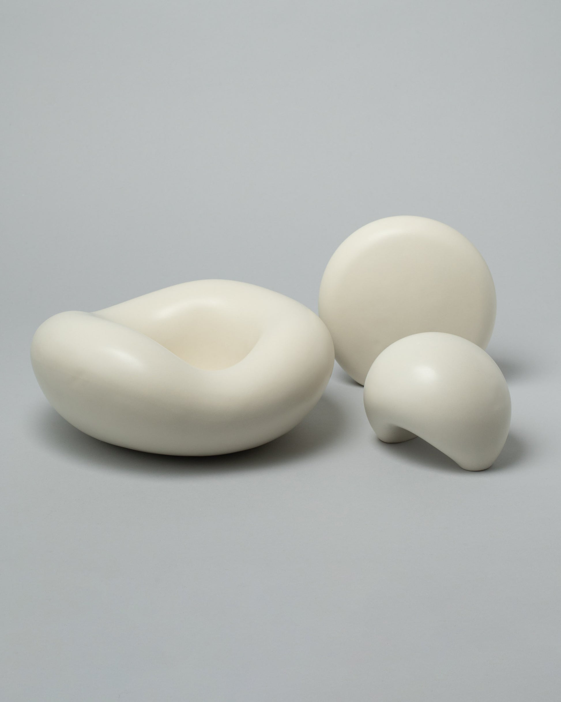 Group photo of Dust and Form Unda Form, Listening Form, and Being Form on light colored background.