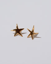 Verve Five Point Star Stud Earrings on light color background.