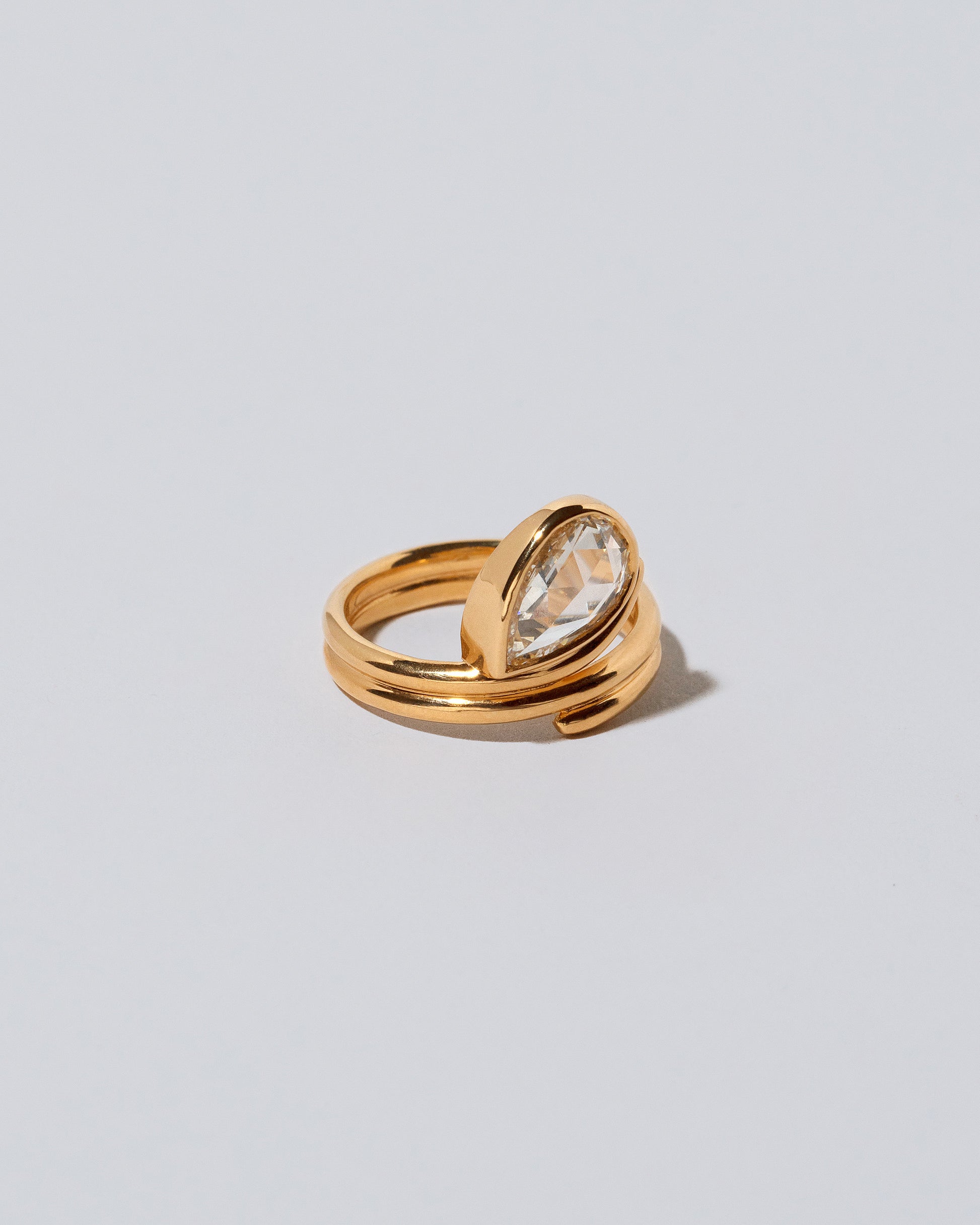 View from the side of the Diamond Light Cutter Ring on light color background.