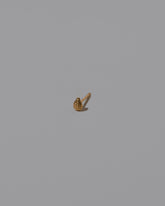 Tear Stud Earring Single on light color background.