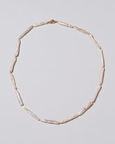 Stick Pearl Strand Necklace on light color background.