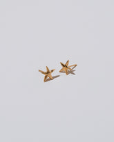 Shape One Small Verve Five Point Star Stud Earrings on light color background.