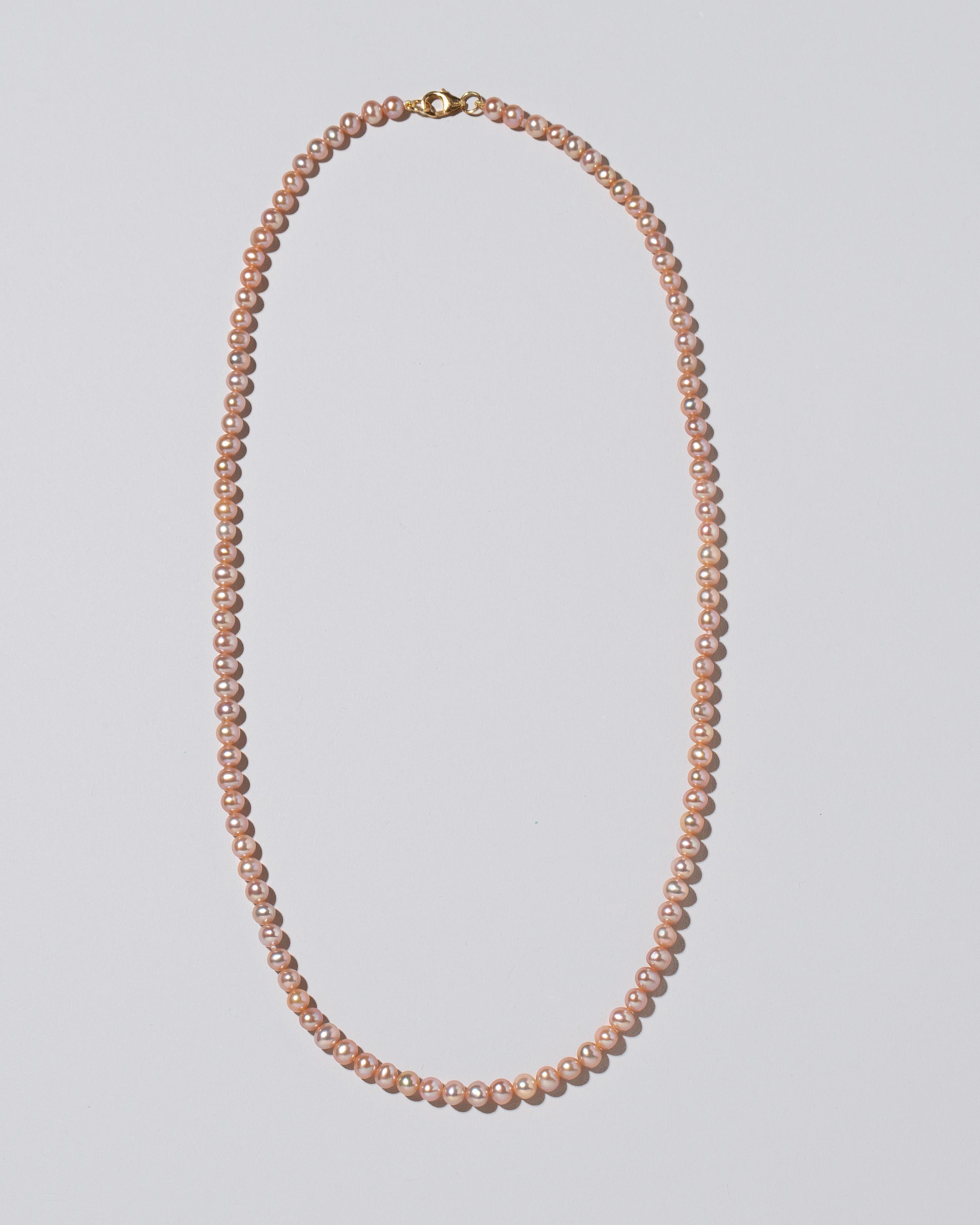 Freshwater Pearl Necklace on light color background.