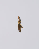 Carl Auböck Brass Hand Keyring on light color background.