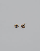 Gold Bicolor Blue Sapphire Level Stud Earrings on light color background.