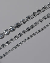 Closeup details of the CRZM Sterling Silver Bedrock Mini Bracelet, Sterling Silver Bedrock Medium Bracelet, and Sterling Silver Bedrock Bracelet on light color background.