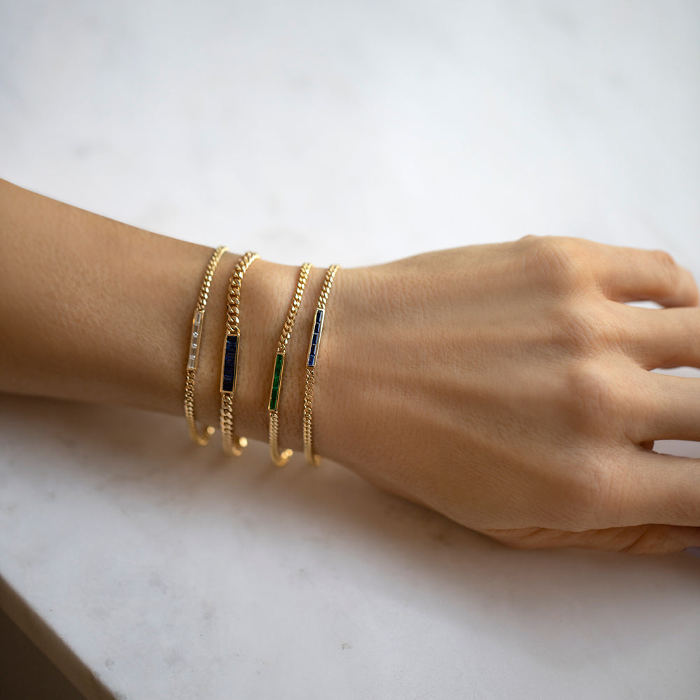 product_details::Group of Blue Sapphire, Emerald and White Diamond 2.4mm Identity Chain Bracelets and a Blue Sapphire 3.4mm Identity Chain Bracelet on model.