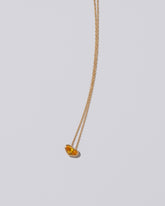 Venus Heart Pendant on light color background.