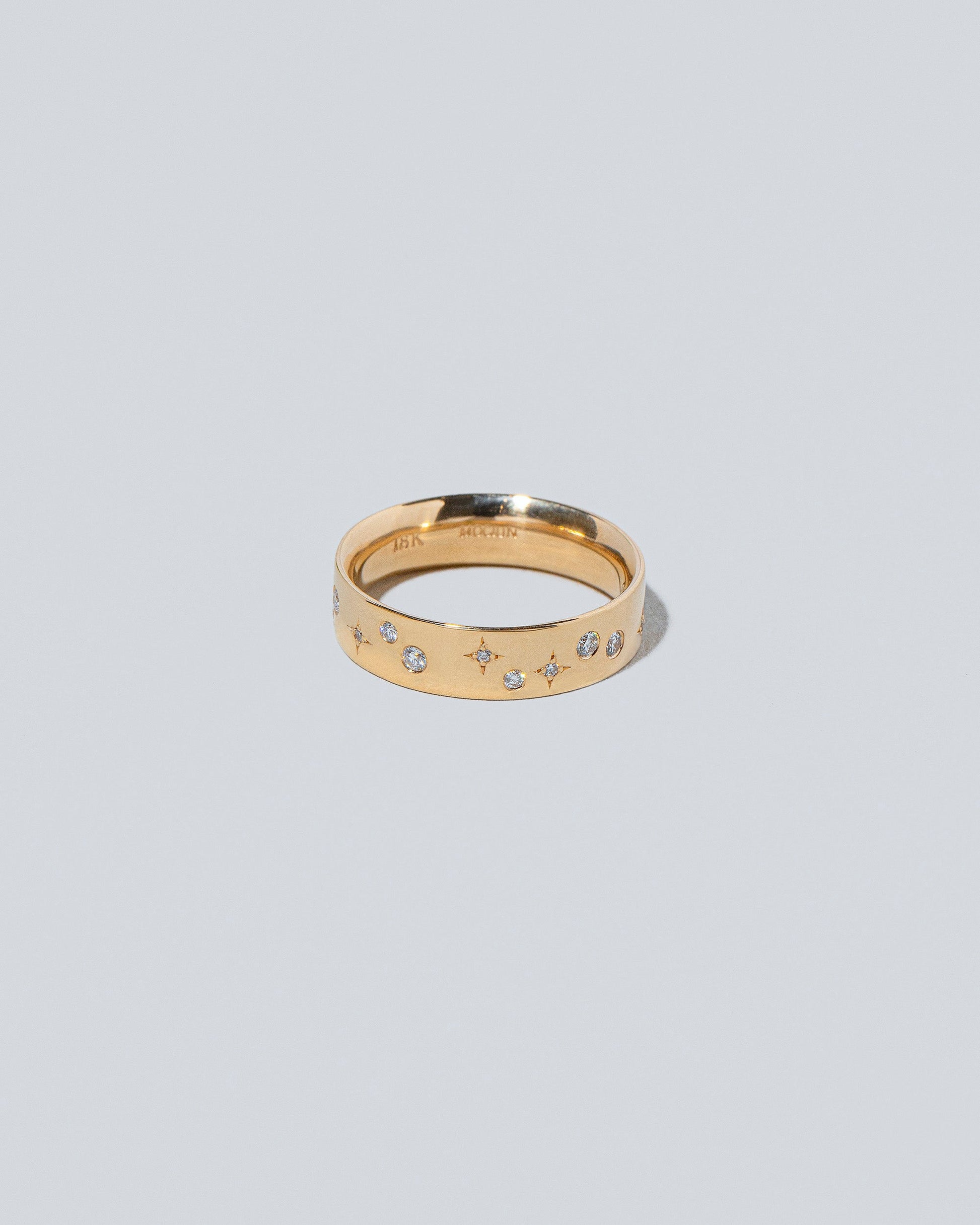 Closeup detail of the Gold 5mm Square Wire Band with Big Array White Diamonds added on light color background.