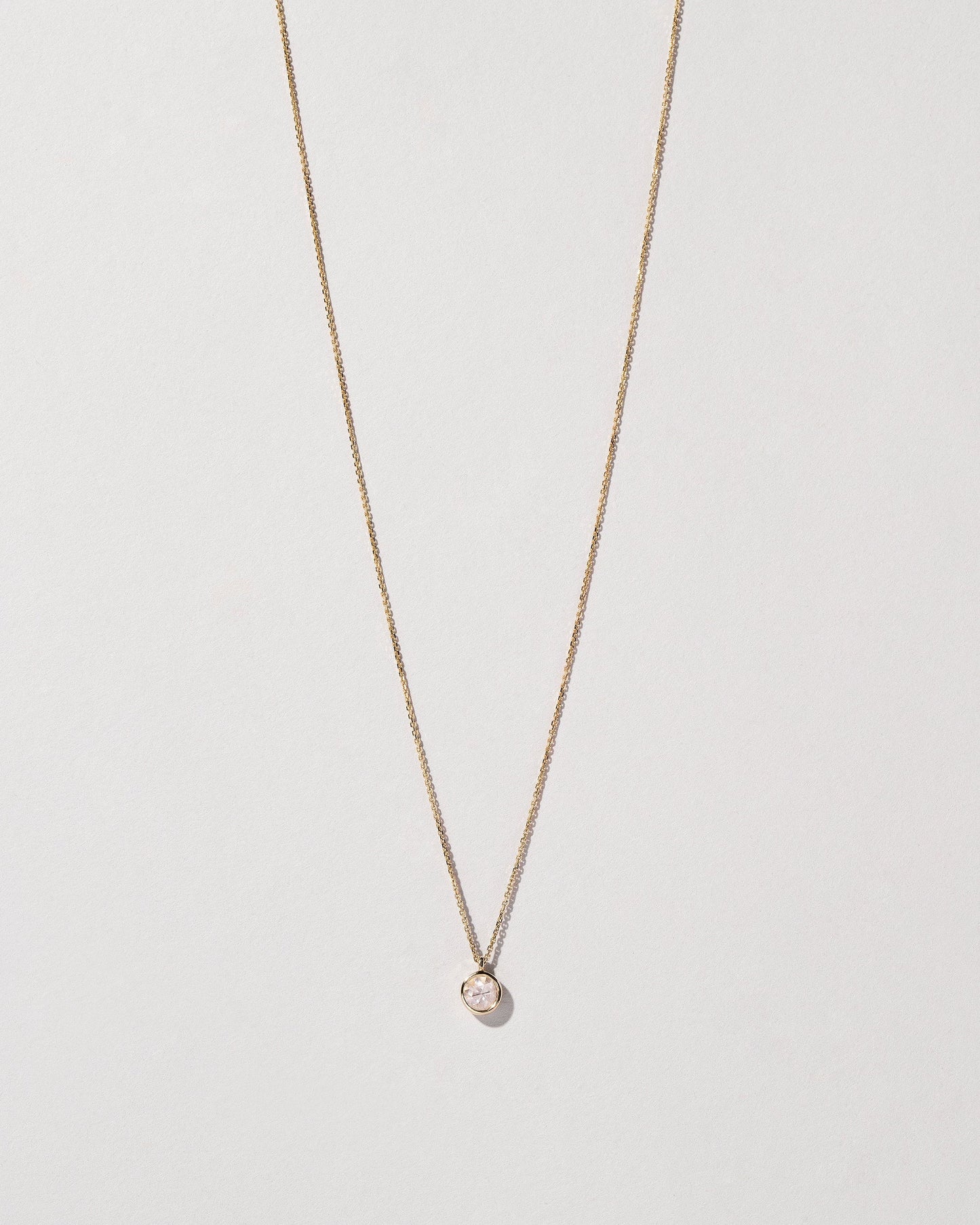 Birthstone Necklace on light color background.