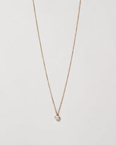 Birthstone Necklace on light color background.
