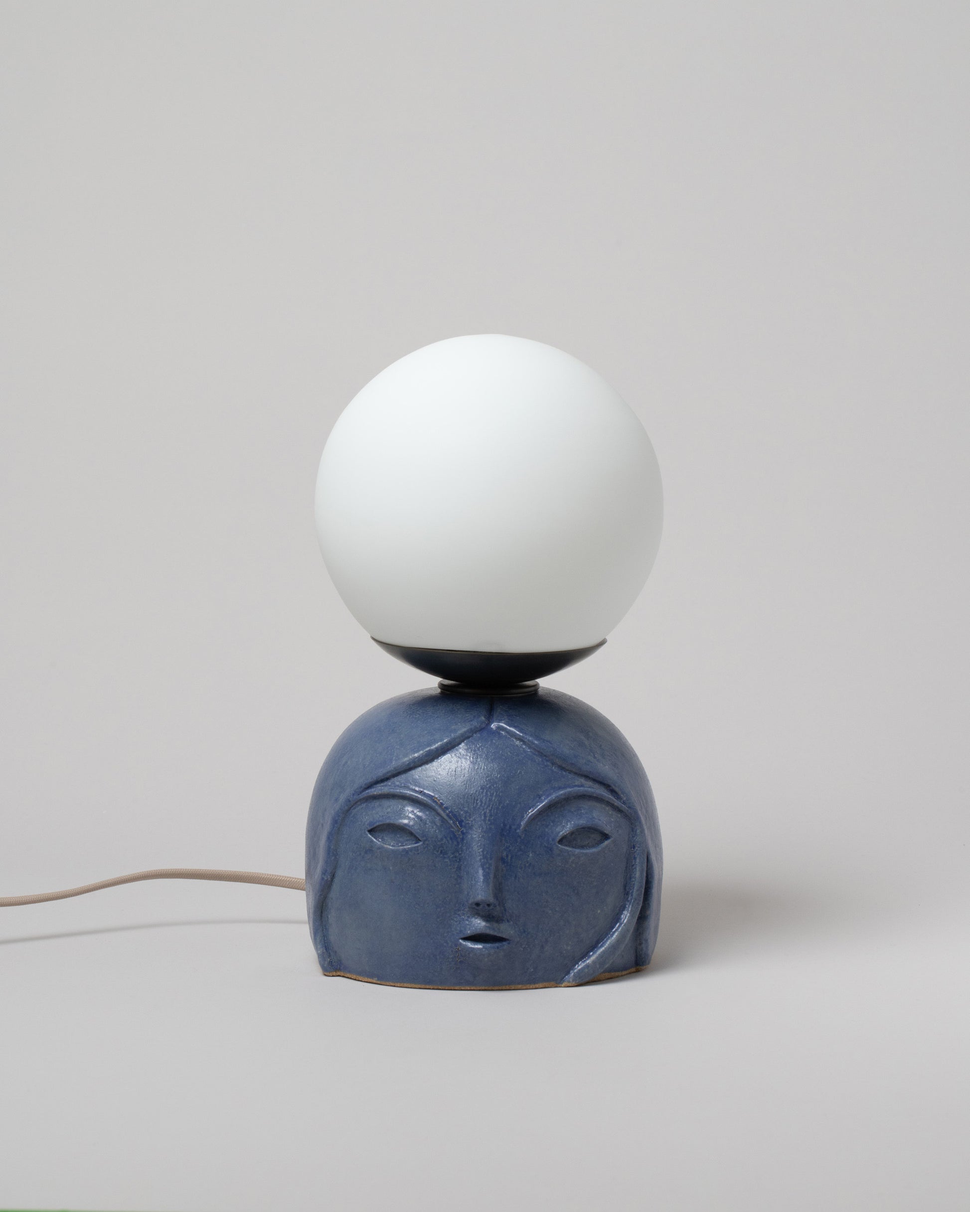 Floating Penelope Table Lamp Small / Persian Blue on light color background.