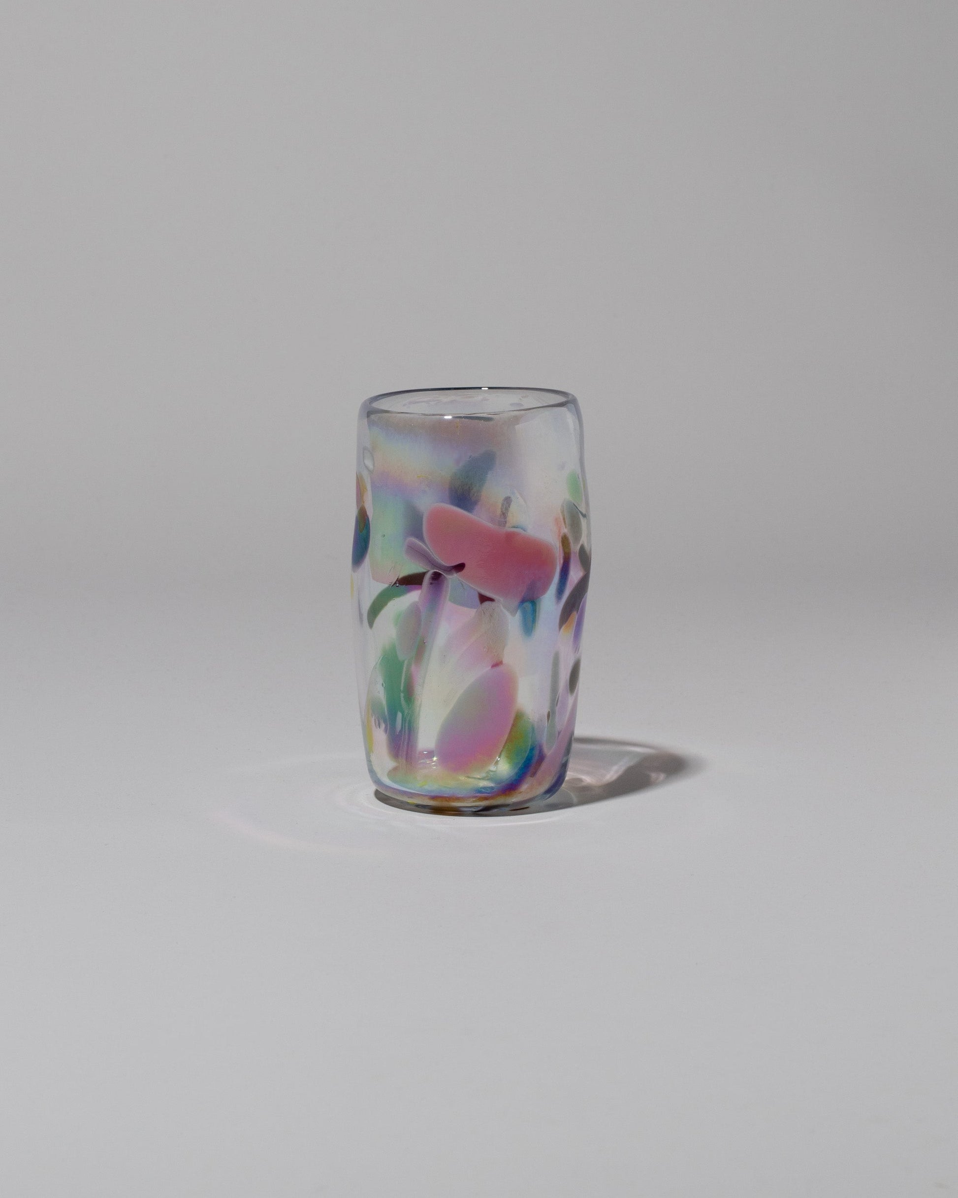 Sirius Glassworks Iridescent Nassau Tumbler on light color background.