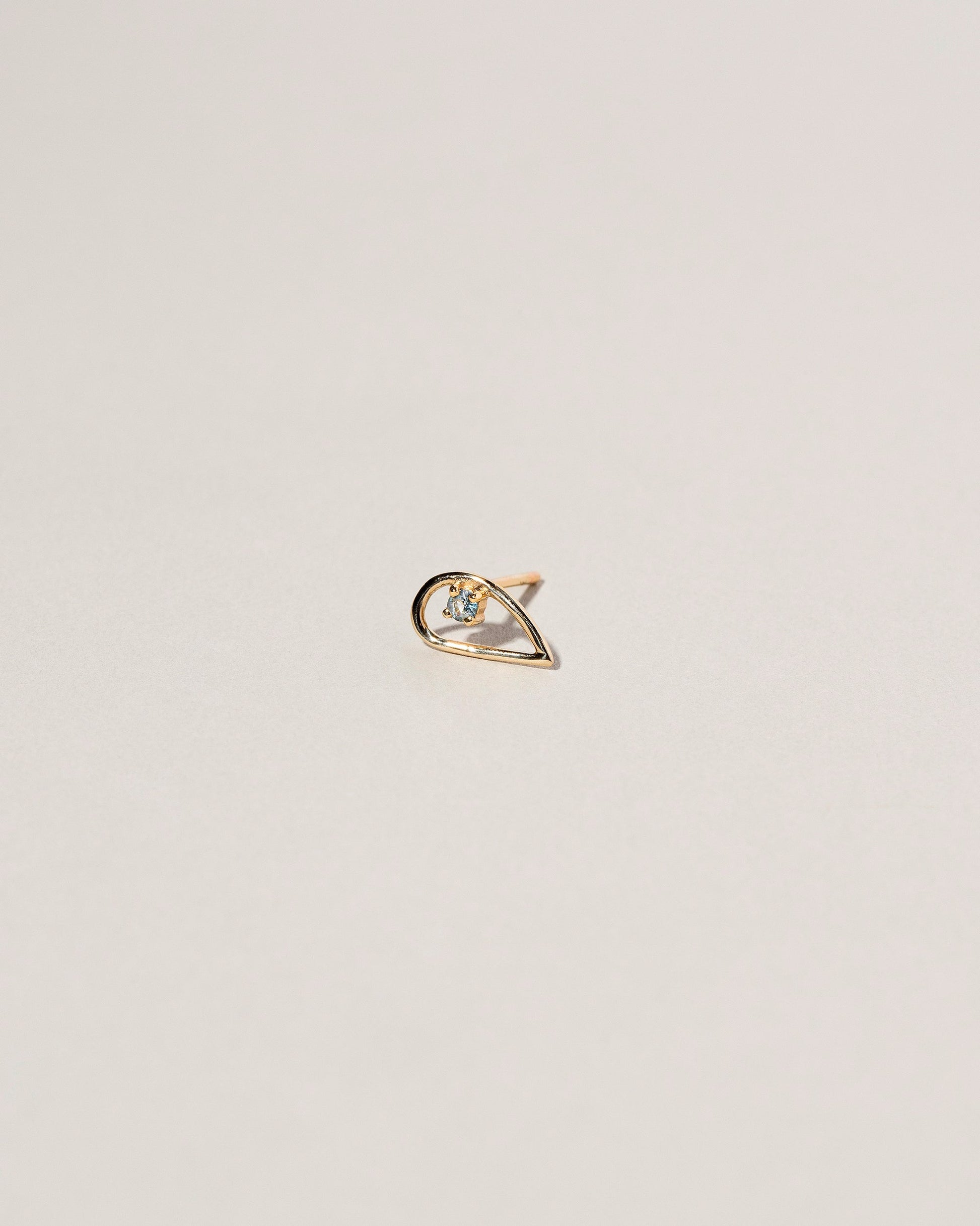 Sun Drop Single Stud on light color background.