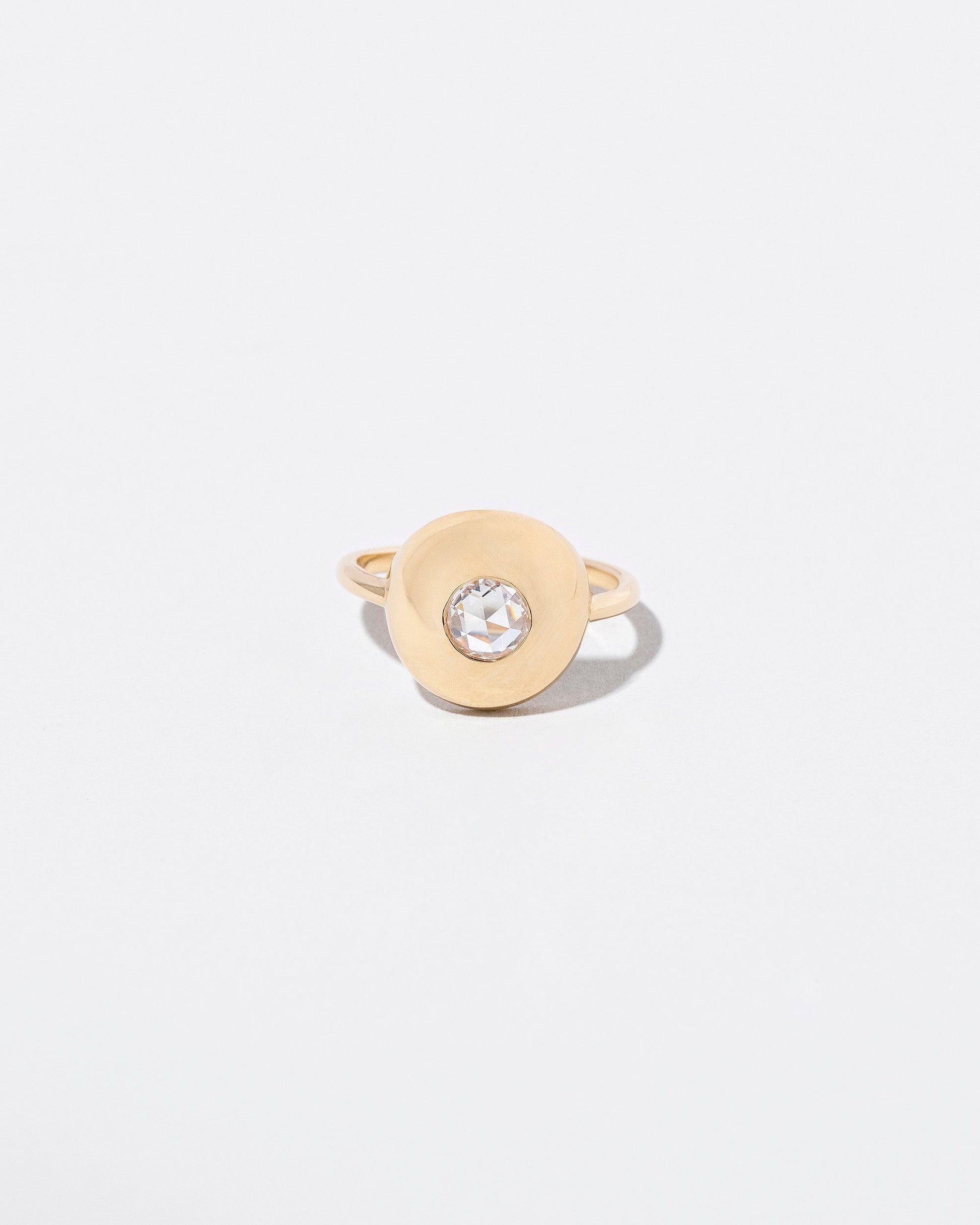 Petite Exposition Ring on light color background.